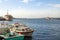 ISTANBUL, TURKEY - DECEMBER 30, 2015: Fishing boats and ferry boats in the harbour of Kadikoy.