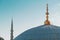 Istanbul Turkey, high minaret of a mosque and a spire with a Crescent moon on top of the dome,