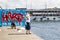 Istanbul, Turkey - September-14,2019: The young man watching the beach on the pier and the garbage on the ground behind. Graffiti