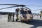 Istanbul, Turkey - September-22,2019: 3 pilots standing next to sikorsky helicopter standing on the runway