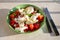 Itaian vegetarian food, fresh caprese salad made with white soft italian mozzarella cheese, red tomato and green basil