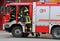 Italia, IT, Italy - May 10, 2018: fire truck and talian firefighters with uniform during fire drill