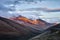 Italian Abruzzo Mountains Monte Camicia and Monte Prena covered by clouds at the evening with last sum beams