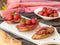 Italian antipasti bruschettas with ham prosciutto, coppa, salami