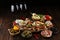 Italian antipasti wine snacks set. Cheese variety, Mediterranean olives, pickles, Prosciutto di Parma, tomatoes, artichokes and