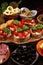 Italian antipasti wine snacks set. Cheese variety, Mediterranean olives, pickles, Prosciutto di Parma, tomatoes, artichokes