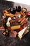 Italian antipasti wine snacks set. Cheese variety, Mediterranean olives, seafood salad, Prosciutto di Parma, tomatoes, anchovy and