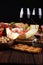 Italian antipasti wine snacks set. Cheese variety, Mediterranean olives, seafood salad, Prosciutto di Parma, tomatoes, anchovy and