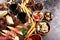 Italian antipasti wine snacks set. Cheese variety, Mediterranean olives, seafood salad, Prosciutto di Parma, tomatoes, anchovy and