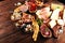 Italian antipasti wine snacks set. Cheese variety, Mediterranean olives, seafood salad, Prosciutto di Parma, tomatoes, anchovy and