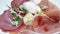 Italian antipasto with, ham and mozzarella