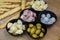 Italian appetizers with green olives, spring onions, porchetta ham, fontina cheese, smoked provola cheese and breadsticks