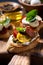 Italian appetizers - various bruschettas, closeup vertical