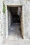 Italian architecture. Passageway, a door in a stone building. European.