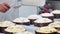 Italian baker sprinkling candy on top preparing panettone christmas cake before baking