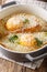 Italian bread Pawese soup close-up in a saucepan. Vertical