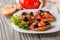 Italian bruschetta with tomato, black olives, lettuce and mustard