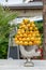 Italian cafe decoration. Big fresh bouquet of many yellow lemons in metallic silver vase. Summer bright decor of fruits