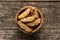 Italian cantuccini cookies in wooden bowl. Sweet dried biscuits with almonds