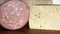Italian cheese asiago type and mortadella in typical food store