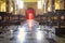 Italian church interior view, with sun rays lighting effects. Color image