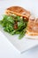 Italian ciabatta panini sandwich with chicken and tomato