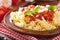 Italian classic pasta fusilli with tomato sauce and basil