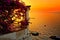 Italian coast sunset from a flower filled terrace overlooking the Mediterranean Sea in Sorrento