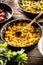 Italian creamy risotto with saffron , turmeric, or butternut in a pan with a wooden spoon