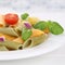 Italian cuisine colorful Penne Rigate noodles pasta meal with to