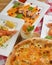 Italian cuisine concept flat lay, top view. Persimmon dishes menu, pizza, shrimps, salad, dessert
