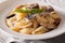 Italian cuisine: Conchiglie with porcini and parmesan close-up.