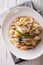 Italian cuisine: Conchiglie with porcini and parmesan close-up.