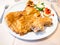 Italian cuisine - Cotoletta alla Milanese on plate