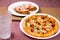 Italian cuisine paneer pizza, garlic bread, soft drink