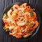 Italian cuisine: pasta with squid, tiger shrimps, vegetables, pa