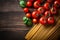 Italian culinary inspiration, pasta, tomatoes on rustic background copy space