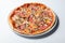 Italian delicious pizza with mushrooms and ham.