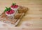 Italian dessert panna cotta with fresh raspberry served in glass bowls on cutting board. Selective focus