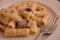 Italian dish pasta mezzemaniche with mushrooms and bechamel cream parmiggiano cheese food