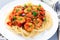 Italian dish shrimp linguine Puttanesca, pasta with shrimps in spicy tomato basil sauce garnished with parsley, horizontal,