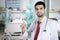 Italian doctor holds syringe in the patient room