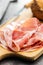Italian dried ham. Coppa Stagionata on cutting board