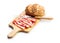 Italian dried ham. Coppa Stagionata on cutting board isolated on white background