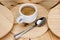 Italian espresso coffee cream with small cup on wooden background