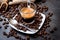 Italian espresso coffee in a glass cup on a black background with coffee beans cutting light