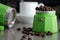 Italian Espresso Maker in Green with Espresso Beans and Cup