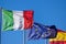 Italian European and Spanish Flags on Blue Sky
