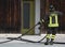 italian fireman collects the water hose after turning off the fire