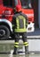 Italian fireman with protective uniform and helmet on h